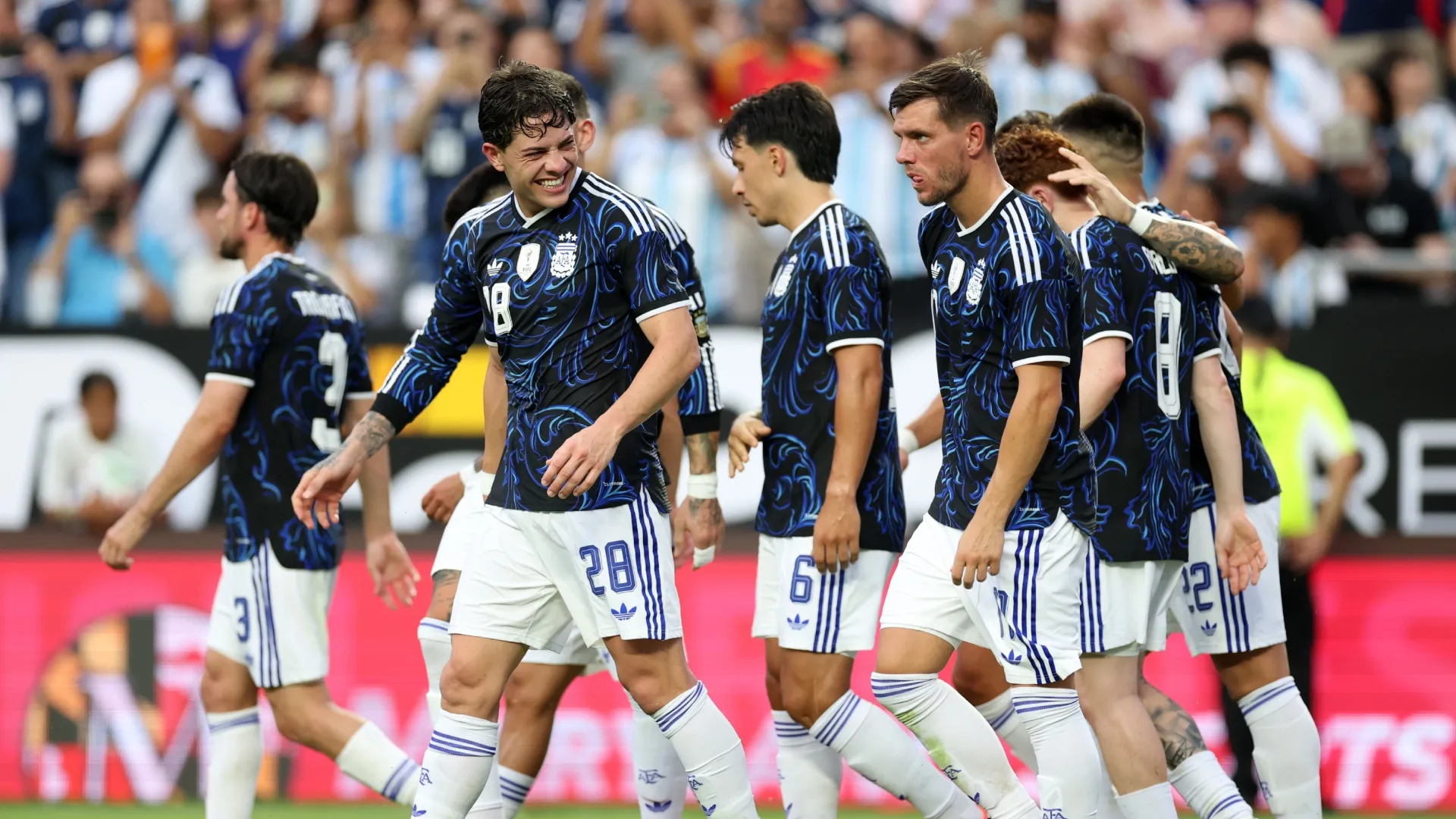 Lautaro Martinez of Argentina celebrates with teammates after scoring against Honduras.