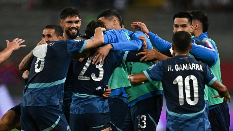 Paraguay's midfielder #23 Matias Galarza celebrates with his teammates after scoring his team's first goal during the